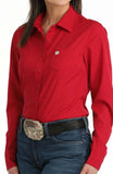 Cinch Women's Long Sleeve Solid Pink Arenaflex Shirt worn with a stylish belt and jeans for casual or performance wear.