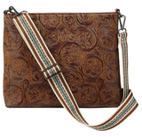 Nocona Women's Amelia floral embossed brown crossbody bag with striped woven nylon strap.