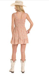 Rock & Roll Denim Women's Floral Burnt Orange Mini Dress with Pockets from the back, paired with cowboy boots.