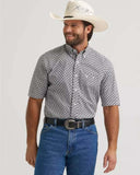 Wrangler Men's George Strait One Pocket Western Shirt in Grey Medallion, paired with a cowboy hat and blue jeans.