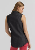 Back view of Wrangler x Lainey Wilson Women's Black Denim Sleeveless Western Shirt styled with pink pants.