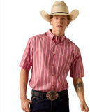 Ariat Men's Pro Series Bobby Classic Fit Short Sleeve Shirt in pink stripes worn by a cowboy with a hat and belt buckle.