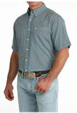 Cinch Men's Short Sleeve Print Arenaflex Shirt in blue and green print, worn with jeans, showcasing western style.