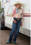 Cruel Girl long sleeve snap western shirt worn by girl in cowboy hat, standing against a trailer, showcasing multicolor floral design.