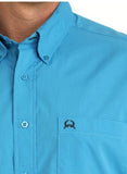 Cinch Men's Arenaflex bright blue short sleeve performance western shirt close-up, showcasing texture and logo.