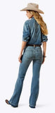 Ariat Women's Perfect Rise Americana Slim Trouser Jeans shown on model from the back, paired with a denim shirt and cowboy hat.