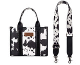 Wrangler Women's Cow Print Concealed Carry Tote & Crossbody Bag with durable PU leather and removable strap