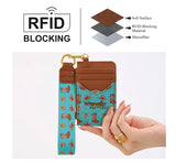 Wrangler Women's Western Print RFID Blocking Wallet in Turquoise held in hand with RFID blocking features highlighted.