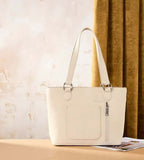 Montana West Tooled Floral Concealed Carry Tote Bag in tan PU leather with cream details and zipper pocket.