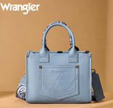 Wrangler Women's Tote Crossbody Bag in light blue with embroidered details and western whipstitch trim.