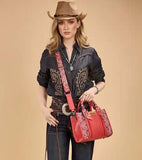 Model wearing Wrangler Women's Braided Paisley Bandana Tote Bag in Red with a cowboy hat and denim outfit.