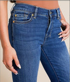 Model showcasing 7 for all mankind Medium Melrose Dojo 30" jeans, emphasizing mid rise flare and denim texture.