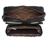 Interior view of Wrangler cow print crossbody purse showing compartments and zipper details.