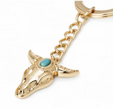 Wrangler Western cowhide cowboy boot bag charm in gold with turquoise detail, perfect for western-themed accessories.