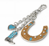 Wrangler Western cowhide horseshoe bag charm with turquoise details and silver accents.