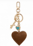 Wrangler cowhide heart bag charm in brown with turquoise enamel heart and vintage filigree details.