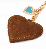 Wrangler cowhide heart bag charm in brown with turquoise enamel detail.