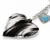 Wrangler cowhide heart bag charm in black with turquoise enamel heart, adding stylish western flair.