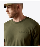 A model wearing an olive green Ariat t-shirt, showcasing the brand logo in a subtle design.