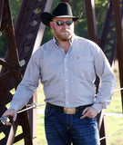 Cinch Men's Long Sleeve Geometric Print Western Shirt in a stylish outdoor setting with cowboy hat and sunglasses.