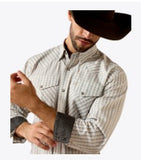 Ariat Men's Wrinkle Free Burnard Classic Fit Snap Shirt with Greater Arm Mobility, stylishly worn under a cowboy hat.