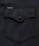 Tecovas black shirt pocket with logo and snap button design for performance western style.
