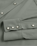 Tecovas men's performance western shirt detail showing cuff with pearl snap buttons in cactus color.