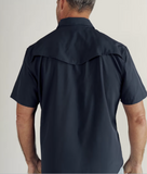 Back view of a man wearing Tecovas Men's Performance Western Short Sleeve Shirt in Navy, showcasing its stylish design.