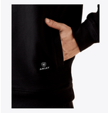 Close-up of the Ariat Men's Caldwell 1/4 Zip in Black, showcasing the logo and pocket detail for western style and performance.