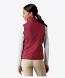 Ariat Youth Bella Reversible Insulated Vest in solid burgundy color, showing the back view of a girl wearing it.