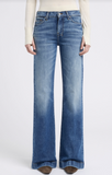 7 For All Mankind Dojo Tailorless Flare Jeans in mid wash, showcasing a fitted design and wide, flared leg silhouette.