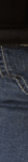 Close-up of blue denim jeans showing stitching and texture details, perfect for everyday wear.