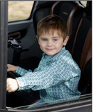 Cinch infant and toddler boys' turquoise western shirt worn by a smiling boy in a vehicle.