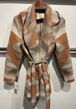 Navajo tie front blanket wrap jacket in copper rust with a belted design and hood.