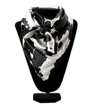 M & F Womens Cow print Wild Rag in black and white silk on display, measuring 33'x33'.